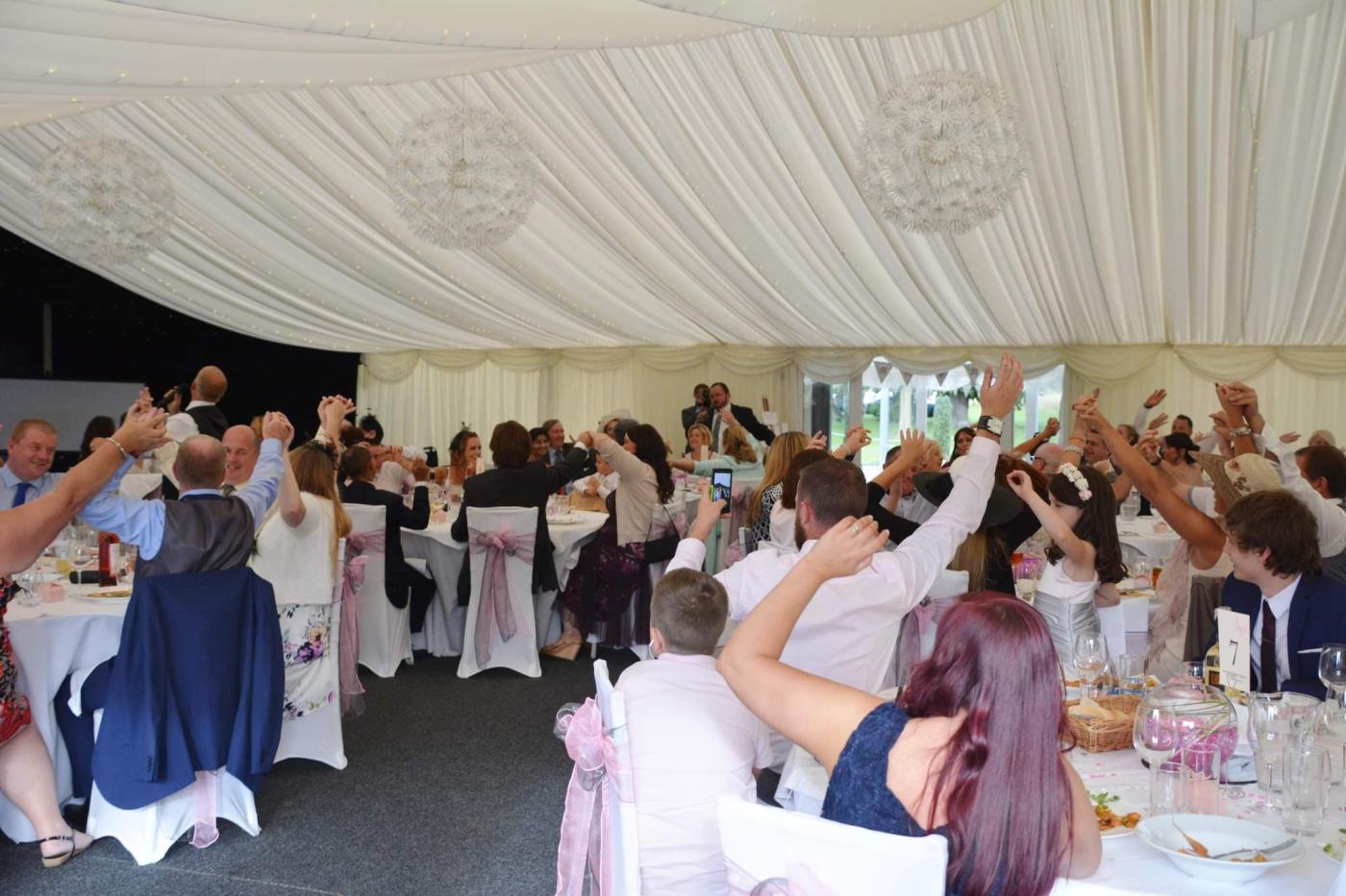 Singing Waiters in a Marquee