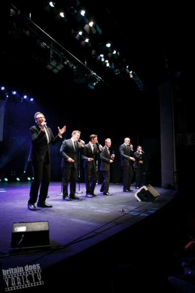 Acafellas Band Norwich performing in a theatre