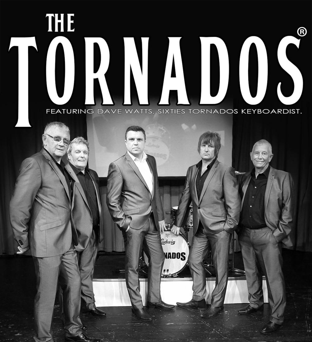 The Tornados Band standing in front of the stage