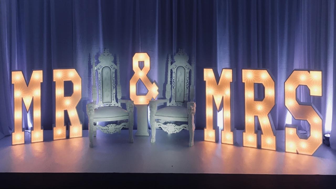 Letters and chairs on stage
