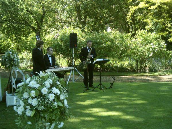 The Matt Hodge band playing outside in a garden