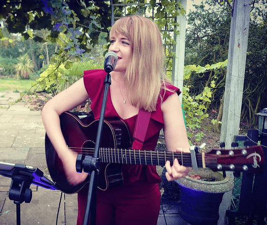 Serena Grant singer performing in a Garden