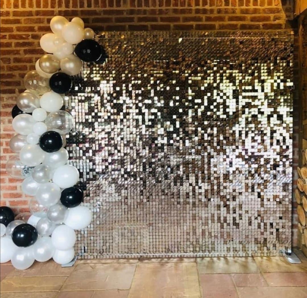 Silver Shimmer Wall Backdrop with Silver and Black ballooons