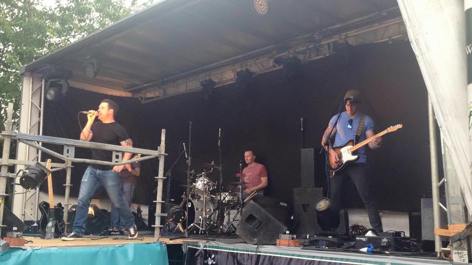 Agent Orange performing at an outside festival